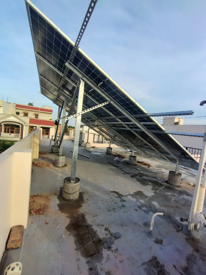 Underside of a raised solar structure, showing the steel legs, rails and bracing